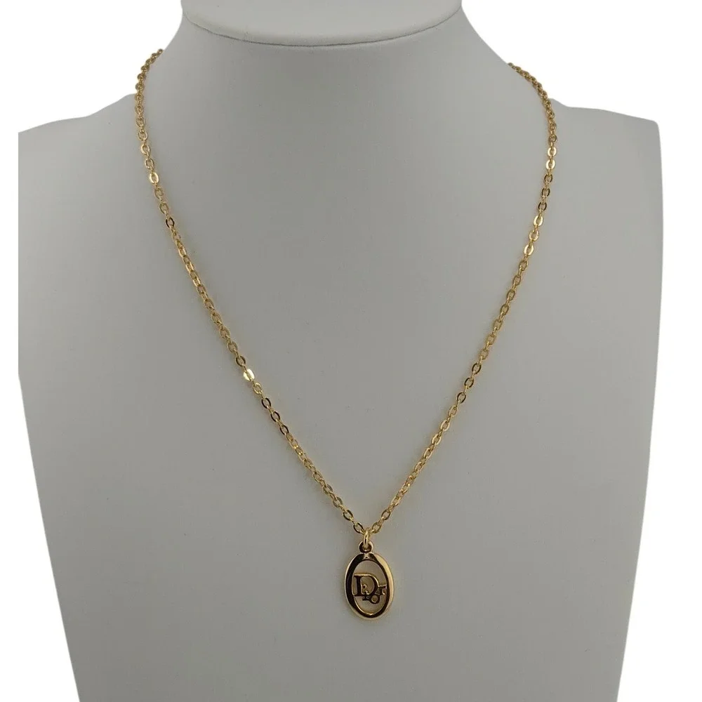 Christian Dior Gold Tone Oval Logo Pendant Necklace Adjustable Chain Vintage